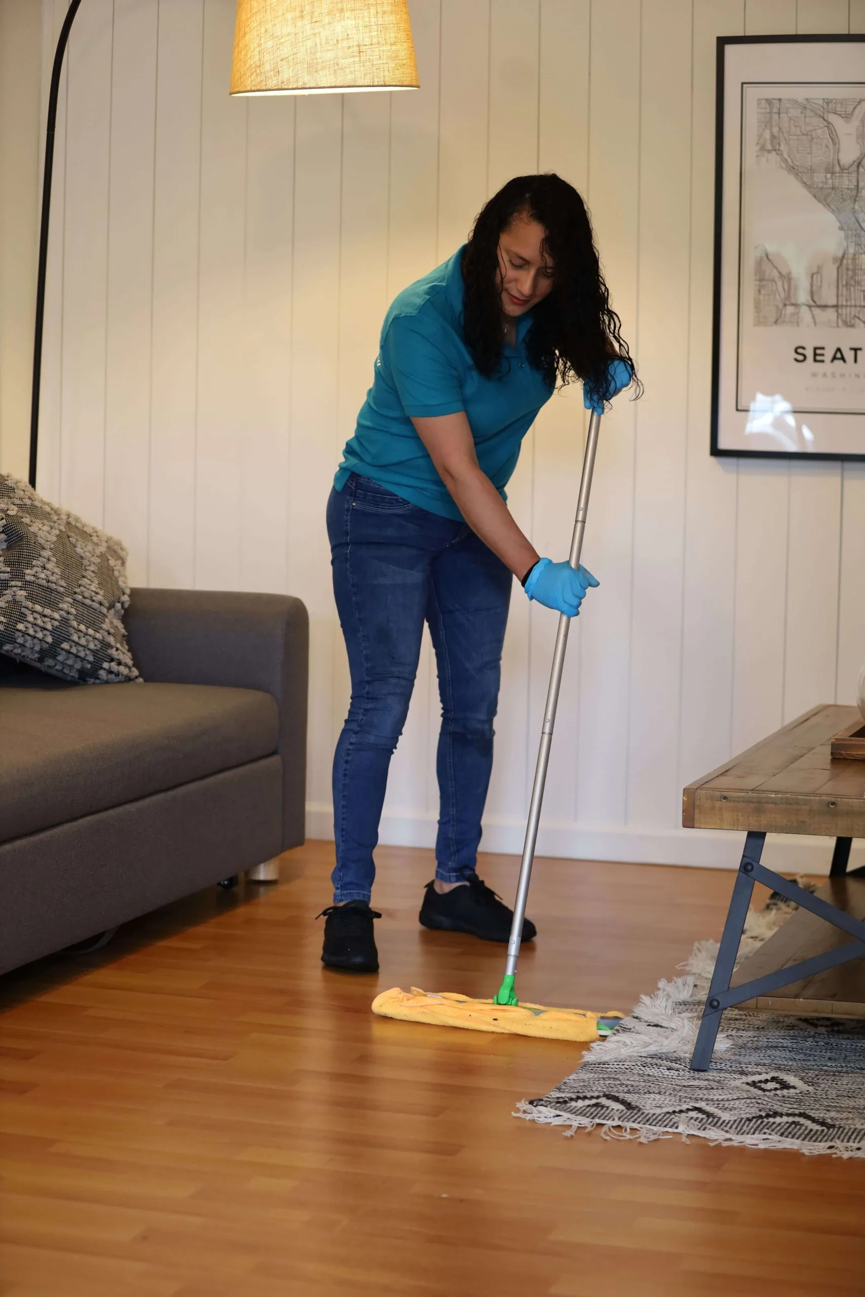 A person of our staff mopping the floor