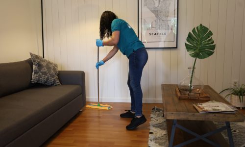 a girl sweeping the floor