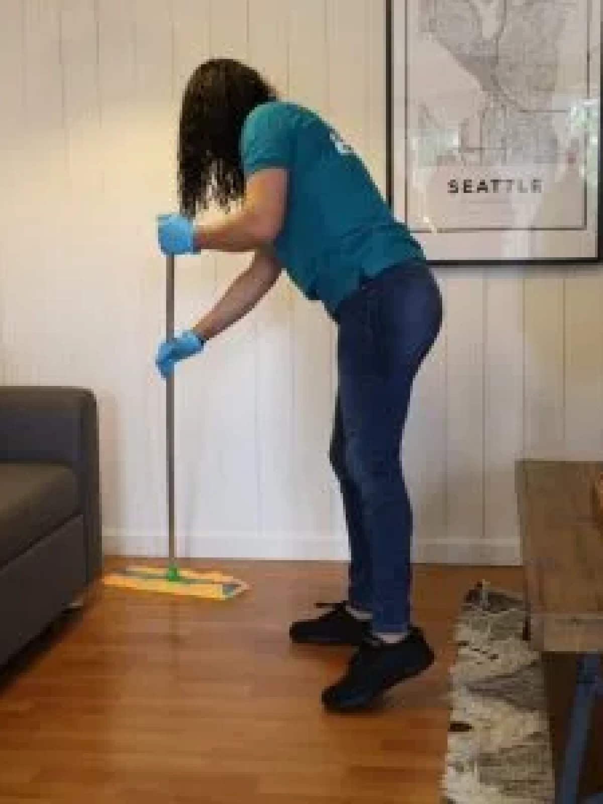 A Woman mopping the floor